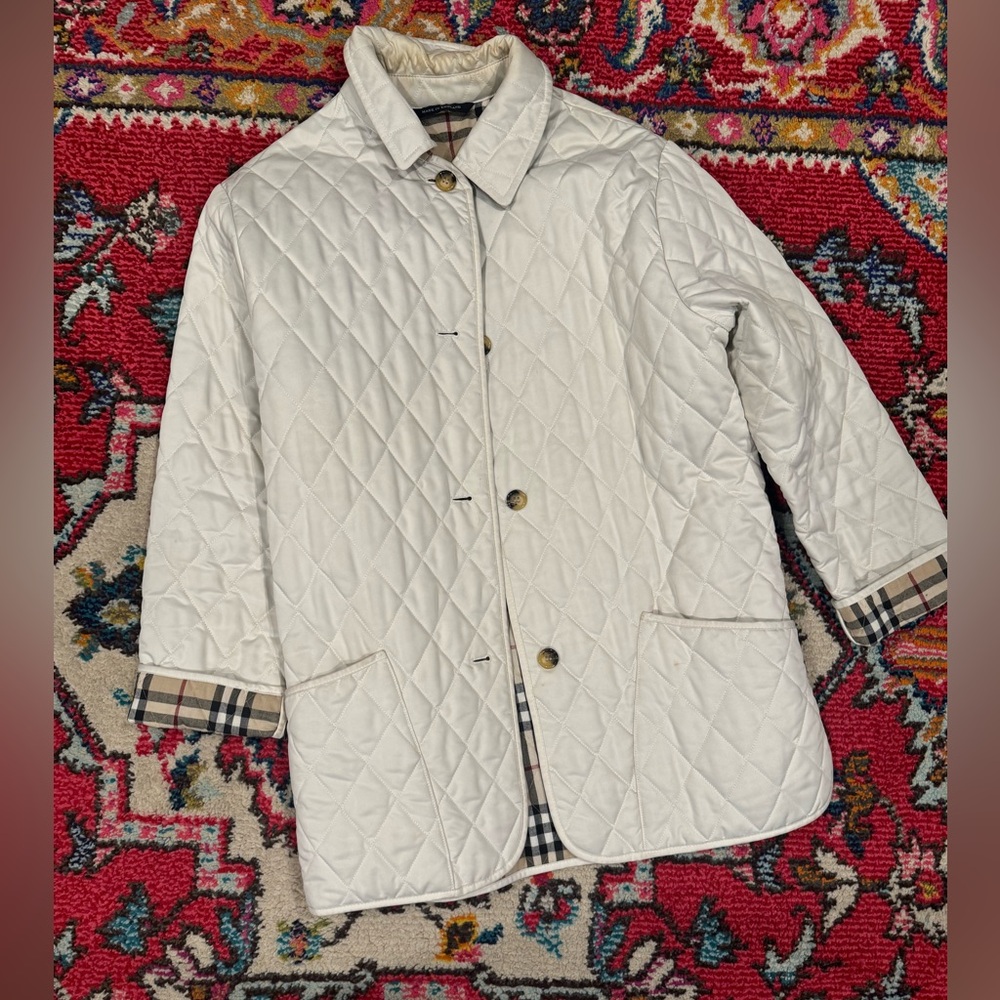 Authentic Burberry jacket size small in good condition. As is.